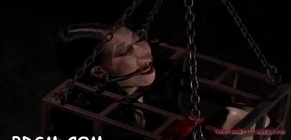  Clamped up hottie gets a hook in her anal with toy torture